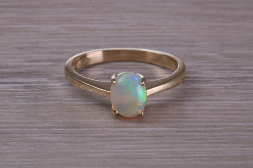 Oval cut Natural Opal set Yellow Gold Ring