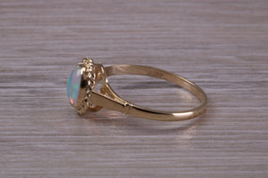 Oval cut Natural Opal set Yellow Gold Ring