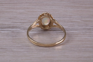 Oval cut Natural Opal set Yellow Gold Ring