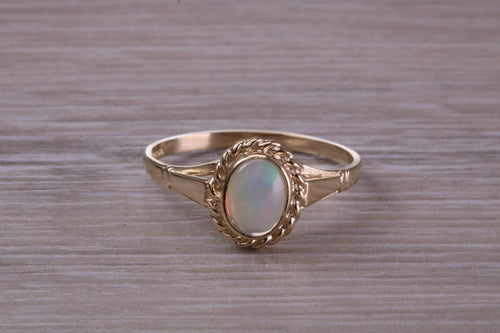 Oval cut Natural Opal set Yellow Gold Ring