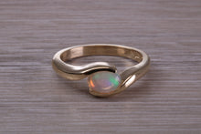 Load image into Gallery viewer, Oval cut Natural Opal set in Chunky Crossover Yellow Gold Ring