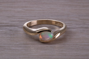 Oval cut Natural Opal set in Chunky Crossover Yellow Gold Ring