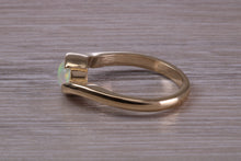 Load image into Gallery viewer, Oval cut Natural Opal set in Chunky Crossover Yellow Gold Ring