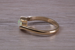 Oval cut Natural Opal set in Chunky Crossover Yellow Gold Ring