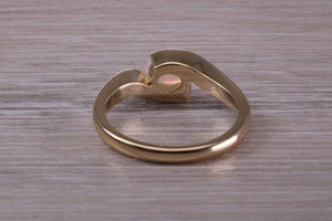 Oval cut Natural Opal set in Chunky Crossover Yellow Gold Ring