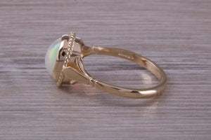 Oval cut Natural Opal set Yellow Gold Ring