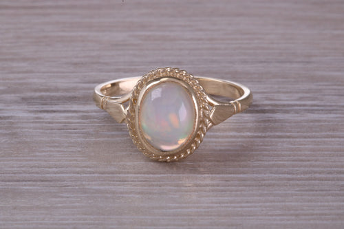 Oval cut Natural Opal set Yellow Gold Ring