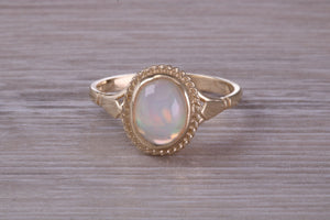 Oval cut Natural Opal set Yellow Gold Ring