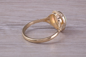 Oval cut Natural Opal set Yellow Gold Ring