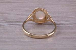 Oval cut Natural Opal set Yellow Gold Ring