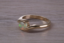 Load image into Gallery viewer, Oval cut Natural Opal set in Chunky Crossover Yellow Gold Ring