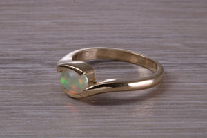 Oval cut Natural Opal set in Chunky Crossover Yellow Gold Ring
