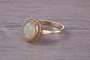 Oval cut Natural Opal set Yellow Gold Ring