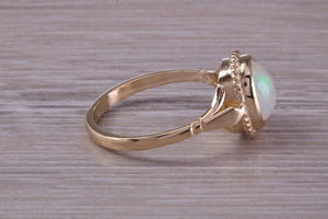 Oval cut Natural Opal set Yellow Gold Ring