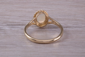 Oval cut Natural Opal set Yellow Gold Ring