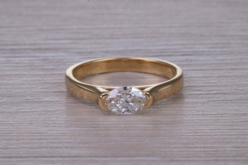 Half carat Oval cut Certified Natural Diamond set 18ct Yellow Gold Solitaire