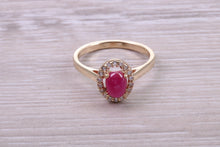 Load image into Gallery viewer, Stunning Cabochon cut 1.40 carat Ruby and Halo set Diamond Ring in Yellow Gold