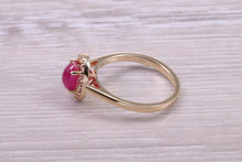Load image into Gallery viewer, Stunning Cabochon cut 1.40 carat Ruby and Halo set Diamond Ring in Yellow Gold
