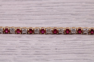 Four carats Natural Rubies and Diamonds set Solid Yellow Gold Tennis Bracelet, British Hallmarked