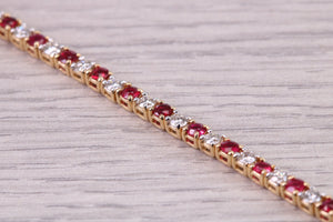 Four carats Natural Rubies and Diamonds set Solid Yellow Gold Tennis Bracelet, British Hallmarked