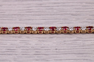 Four carats Natural Rubies and Diamonds set Solid Yellow Gold Tennis Bracelet, British Hallmarked