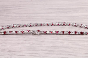 Four carats Natural Rubies and Diamonds set Solid White Gold Tennis Bracelet, British Hallmarked