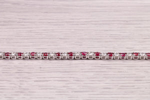 Four carats Natural Rubies and Diamonds set Solid White Gold Tennis Bracelet, British Hallmarked