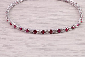 Four carats Natural Rubies and Diamonds set Solid White Gold Tennis Bracelet, British Hallmarked